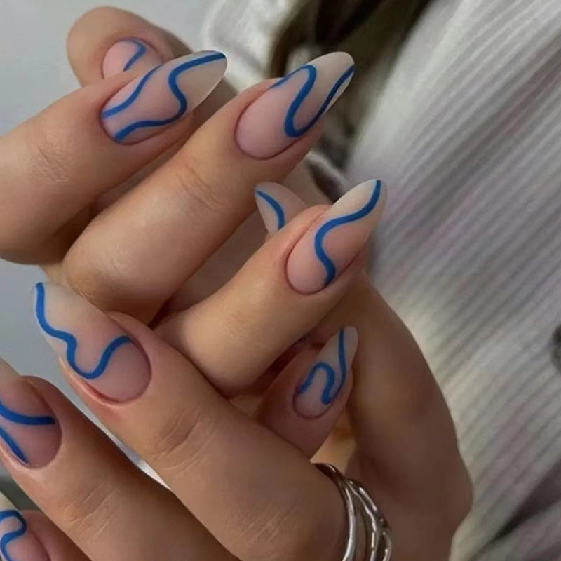 Matte Nude Nails with Blue Wavy Lines